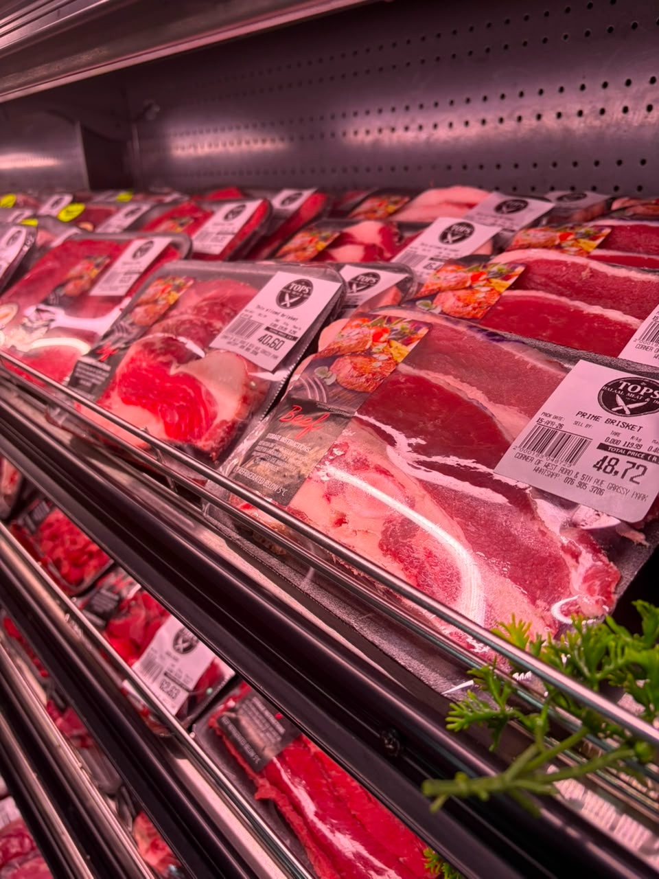 Inside Tops Halaal Meat Market showing fresh counters and stocked displays